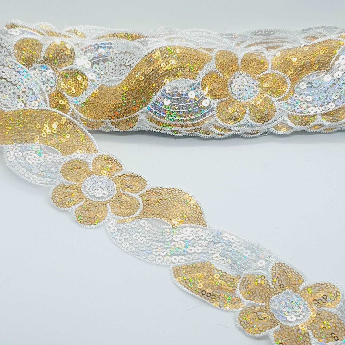 1m 6cm flower net lace with silver & gold hologram sequins