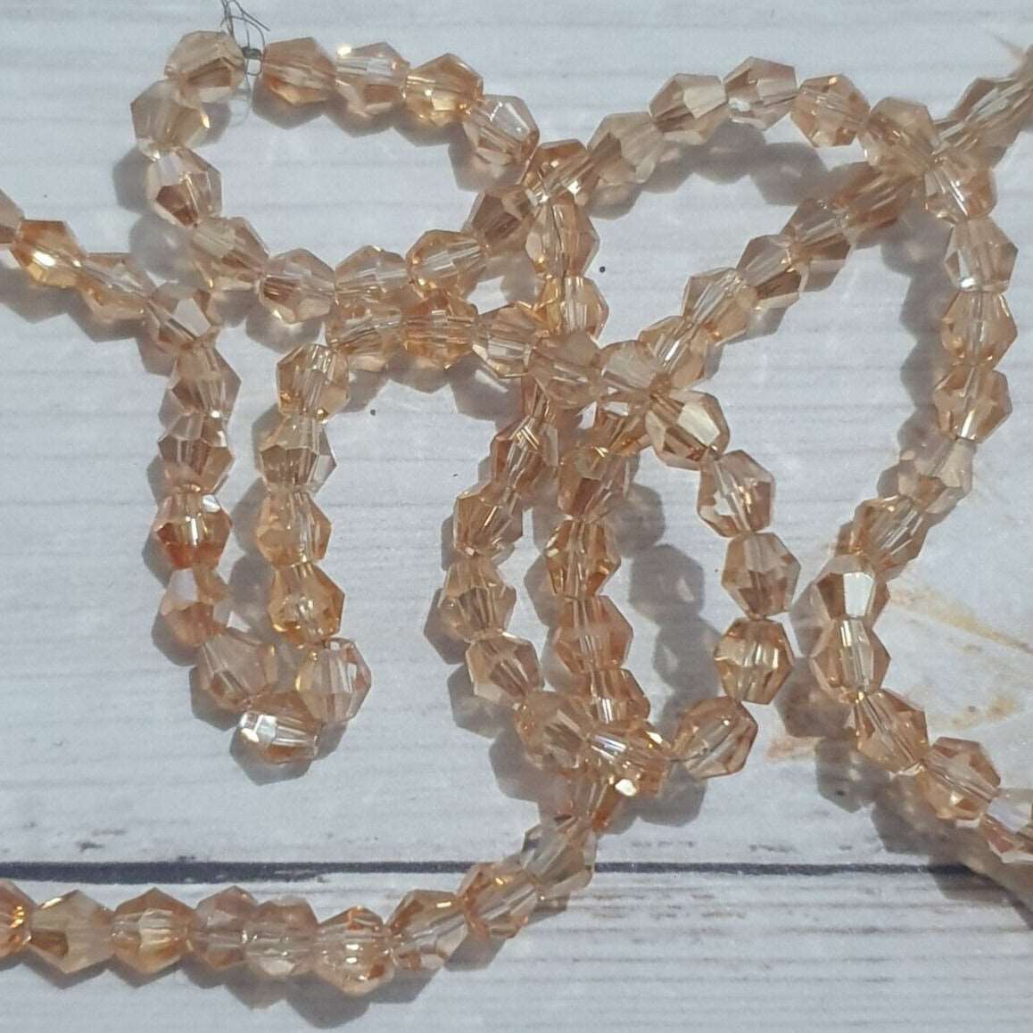 1x ~60 champagne 4mm bicone beads