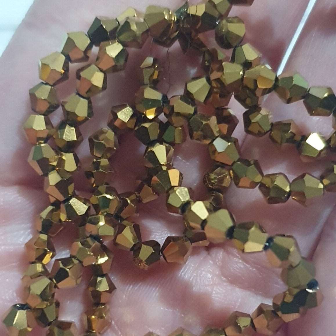 1x~110 metallic gold 4mm bicone beads