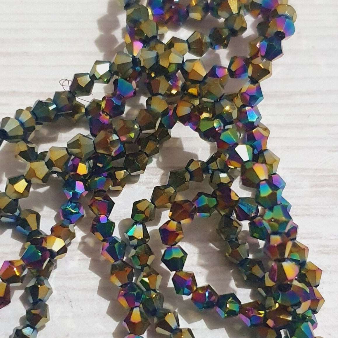 1x~110 metallic green gold AB 4mm bicone beads