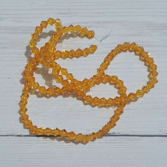 1x ~110 orange 4mm bicone beads