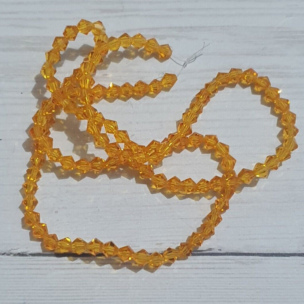 1x ~60 orange 4mm bicone beads