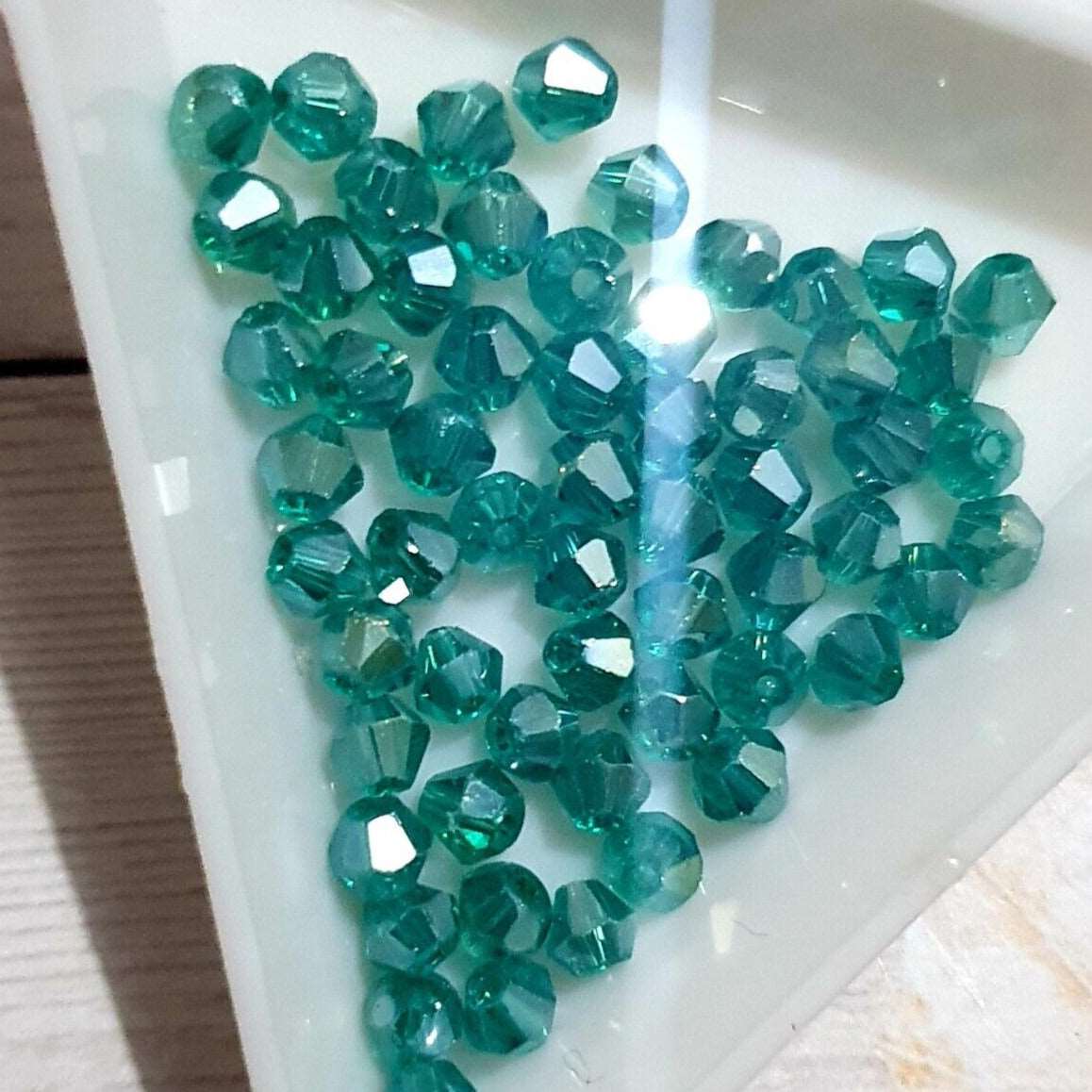 1x ~60 teal 4mm bicone beads